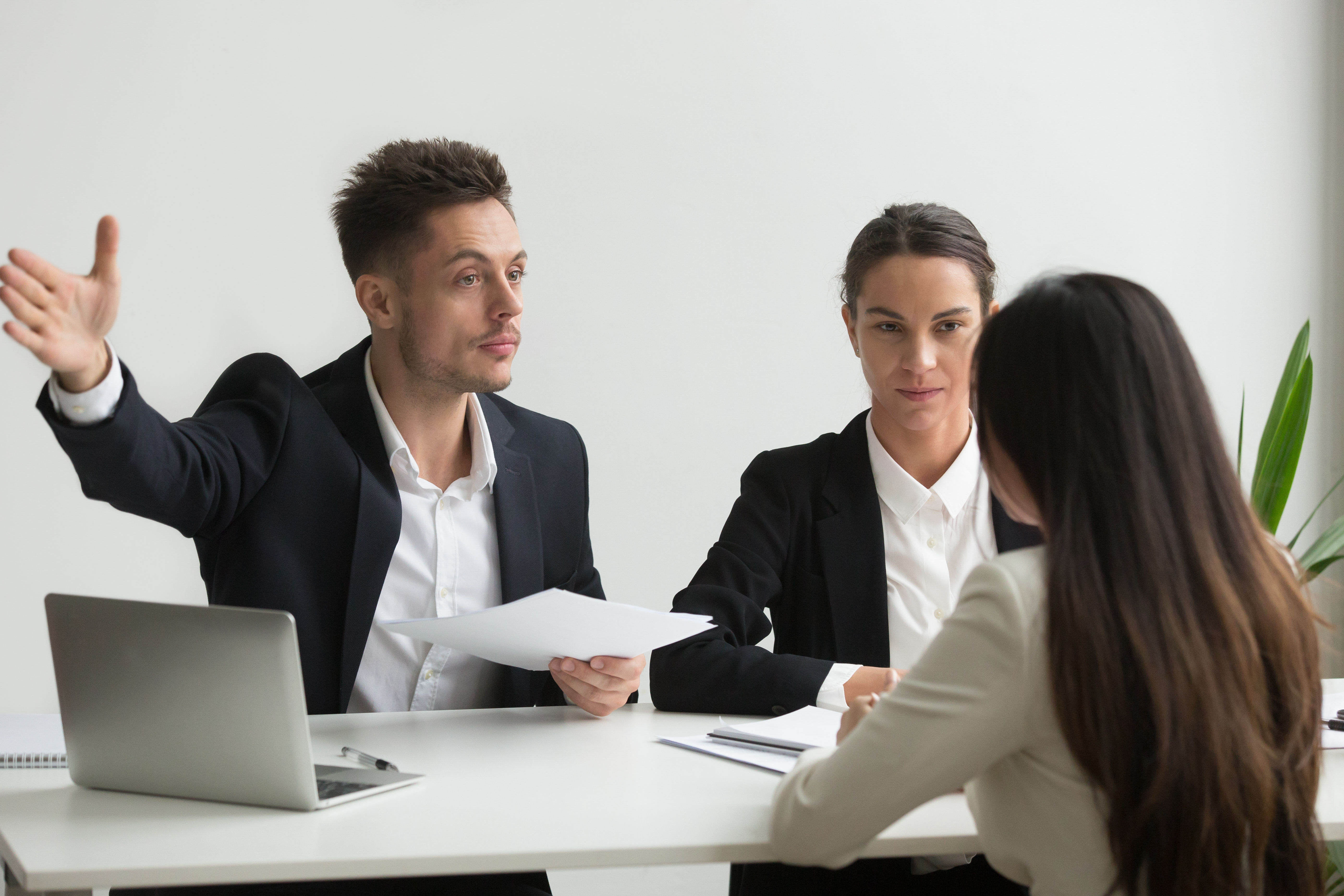 employees in a meeting together discussing